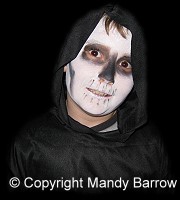 image: boy dressed up as ghoul